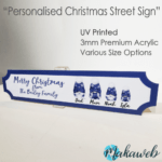 A UV printed Personalised Christmas Blue Gonks family name sign
